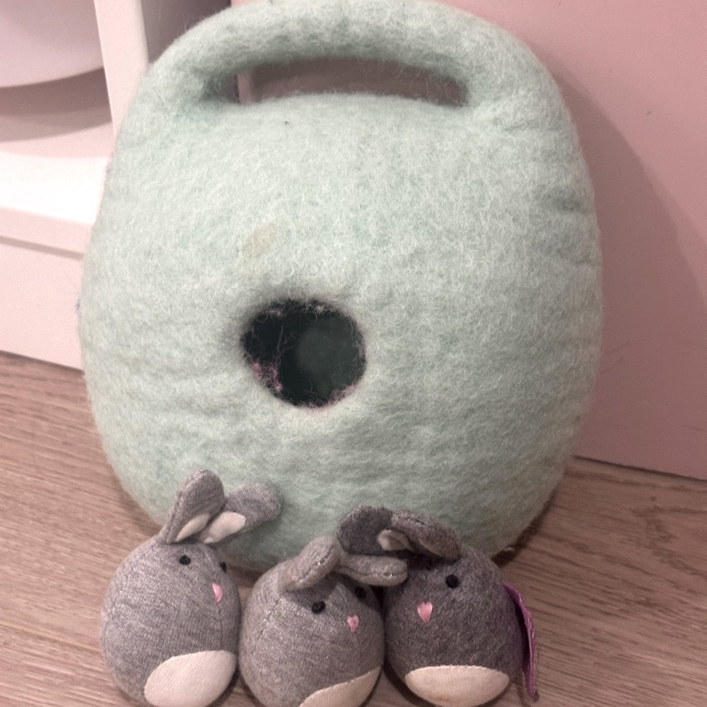 Lovevery bunnies in a felt burrow